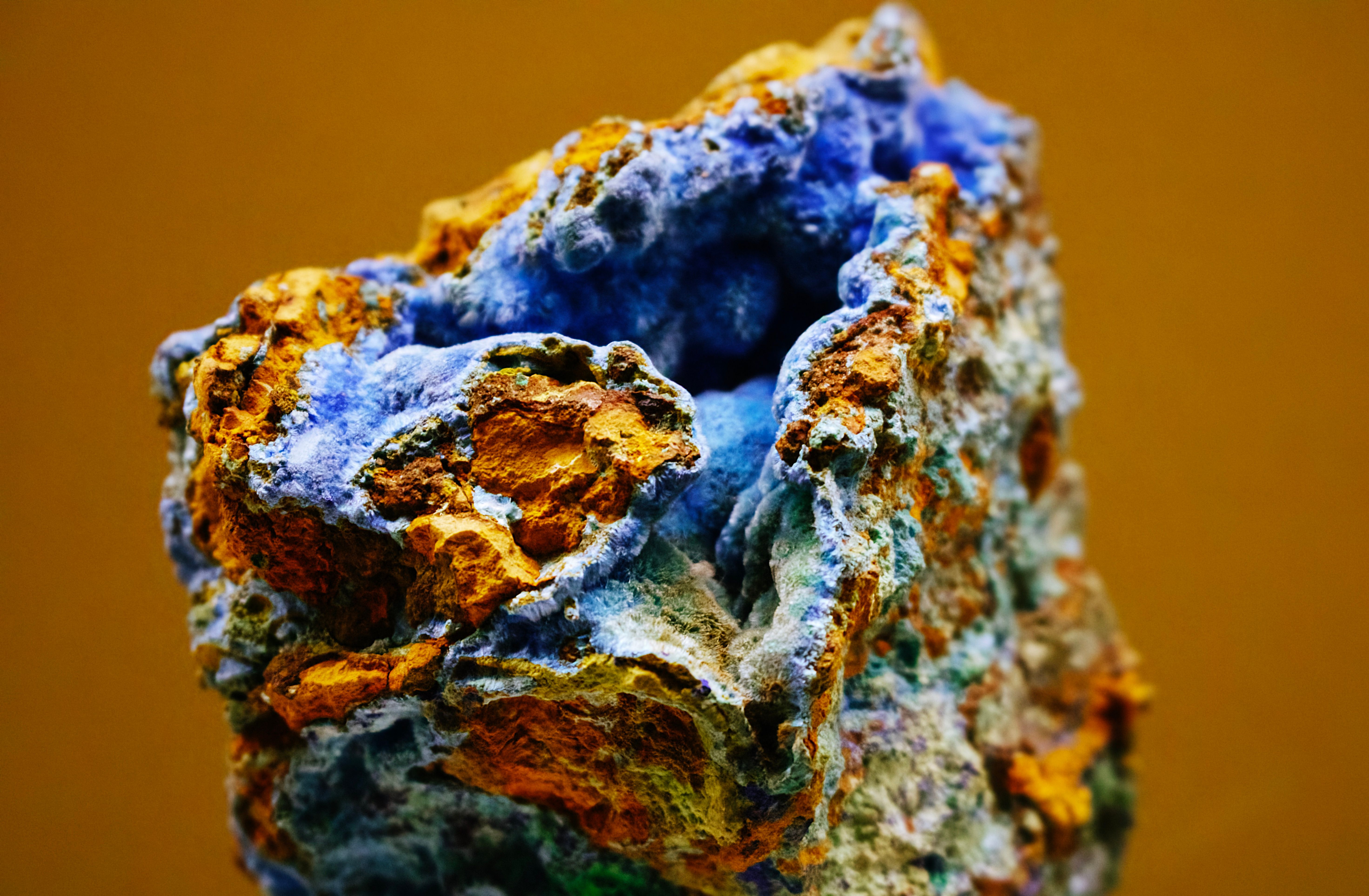 Cobalt-bearing mineral specimen with blue and copper tones