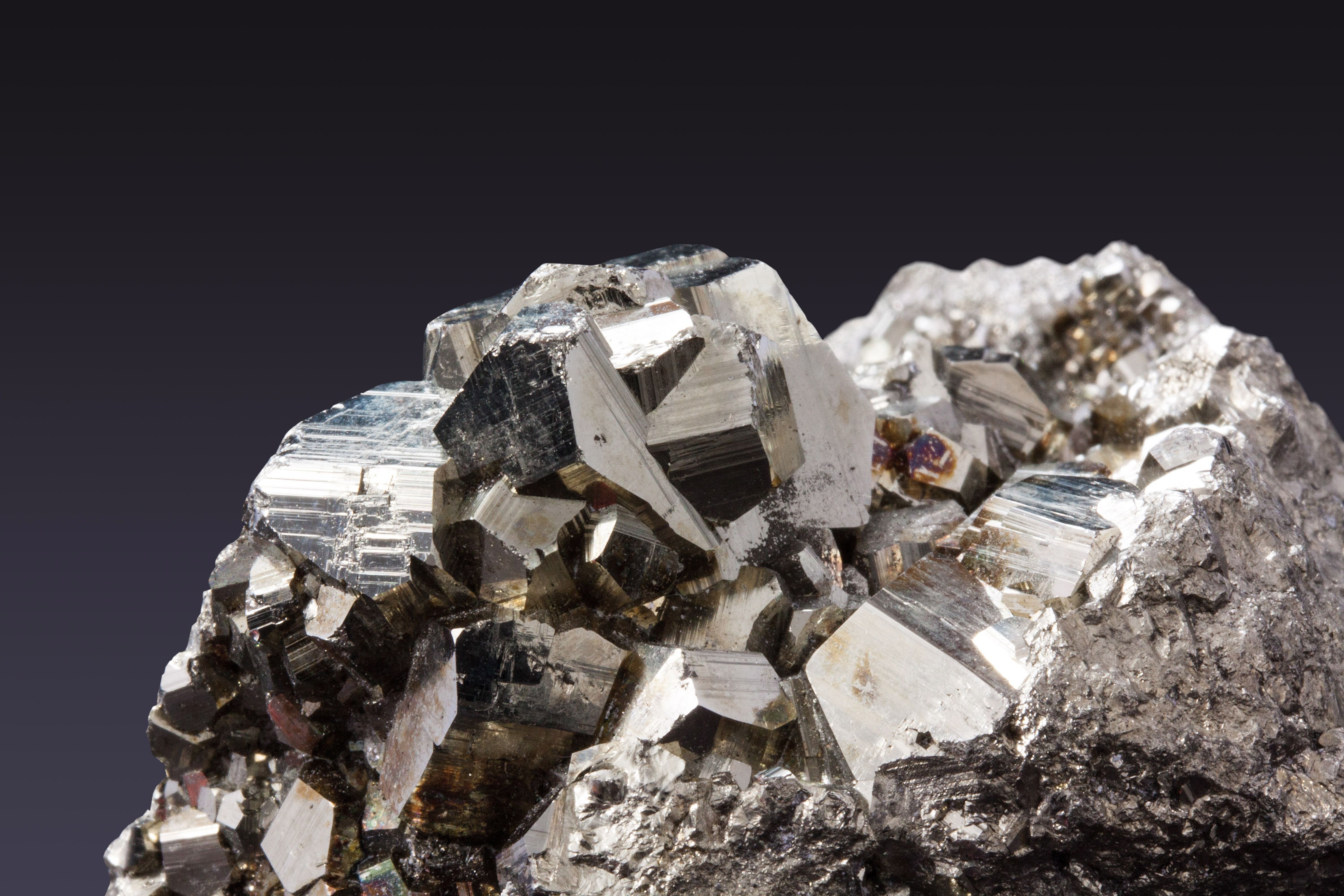 Metallic mineral crystals resembling coltan and tantalum ore